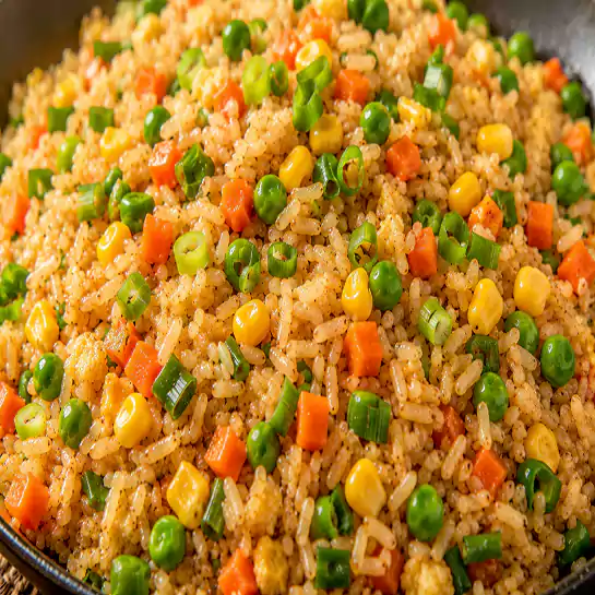 Colorful Fried rice with mixed vegetables (Riz frit avec légumes mélangés) stir-fried to perfection at Harmonie Orientale, LaSalle, Montreal.