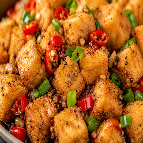 Crispy Fried Tofu salt and pepper (Tofu frit sel et poivre) garnished with green onions and chilies at Harmonie Orientale in LaSalle, Montreal.