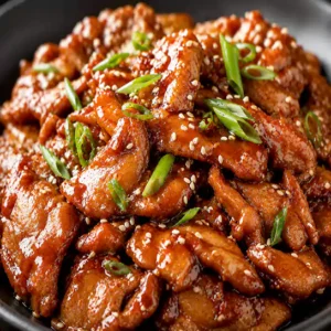 Savory Peking style pork (Porc style pékinois) glazed in a rich traditional sauce at Harmonie Orientale, LaSalle, Montreal.