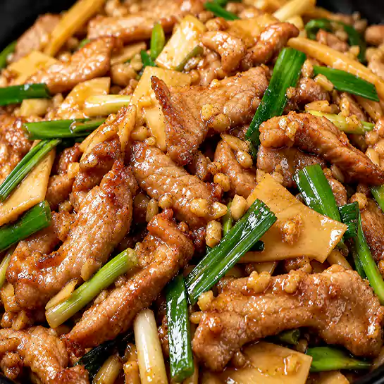 Tender Pork garlic sauce (Émincé de porc à l’ail) stir-fried in a rich aromatic sauce at Harmonie Orientale, LaSalle, Montreal.
