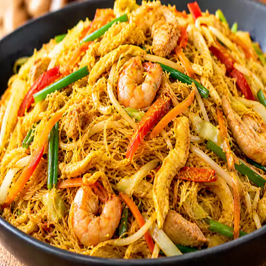 Aromatic Singapore Vermicelli (Vermicelles de Singapore) thin rice noodles with curry seasoning at Harmonie Orientale, LaSalle, Montreal.