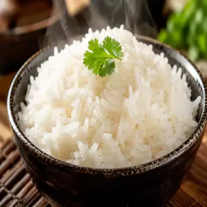 Fluffy and hot Steamed rice (Riz à la vapeur) served in a traditional bowl at Harmonie Orientale, LaSalle, Montreal.