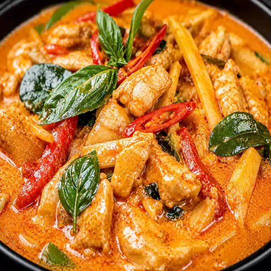 Rich and creamy Thai chicken curry (Au cari vert ou jaune ou rouge) with fresh basil at Harmonie Orientale, LaSalle, Montreal.