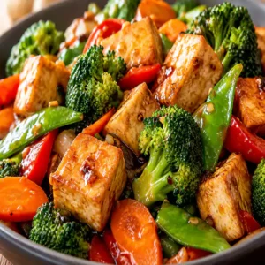 Healthy Tofu & mixed vegetables (Tofu & légumes mélangés) in a glossy savory stir-fry sauce at Harmonie Orientale, LaSalle, Montreal.